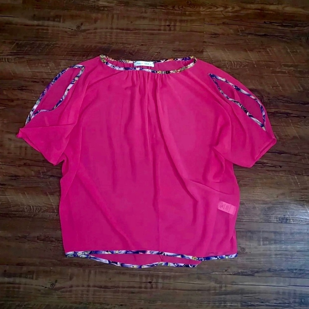 Sheer fuchsia top with trimmed slit on sleeves